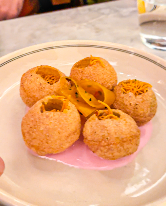 banarasi puri- puri filled with picked pineapple served with beetroot raita