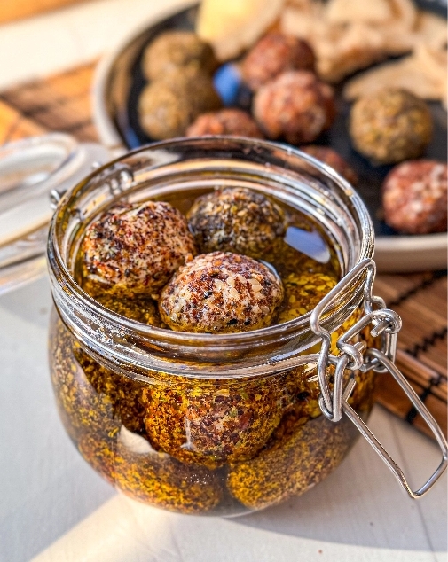 Paneer labneh balls in a jar in olive oil ready to serve